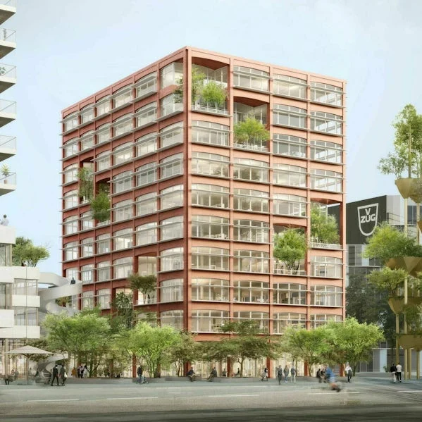 exterieur van de crea tower in zurich met opvallende rode prefab gevelelementen en transparante plint